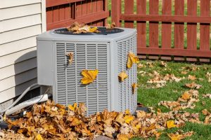 AC-outdoor-unit-with-autumn-leaves