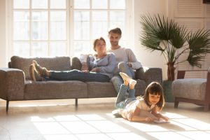 family-relaxing-in-a-sunny-living-room